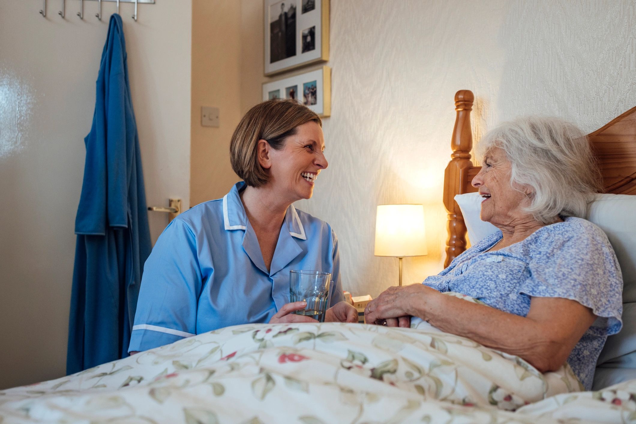 Caregiver helping a senior woman with morning care