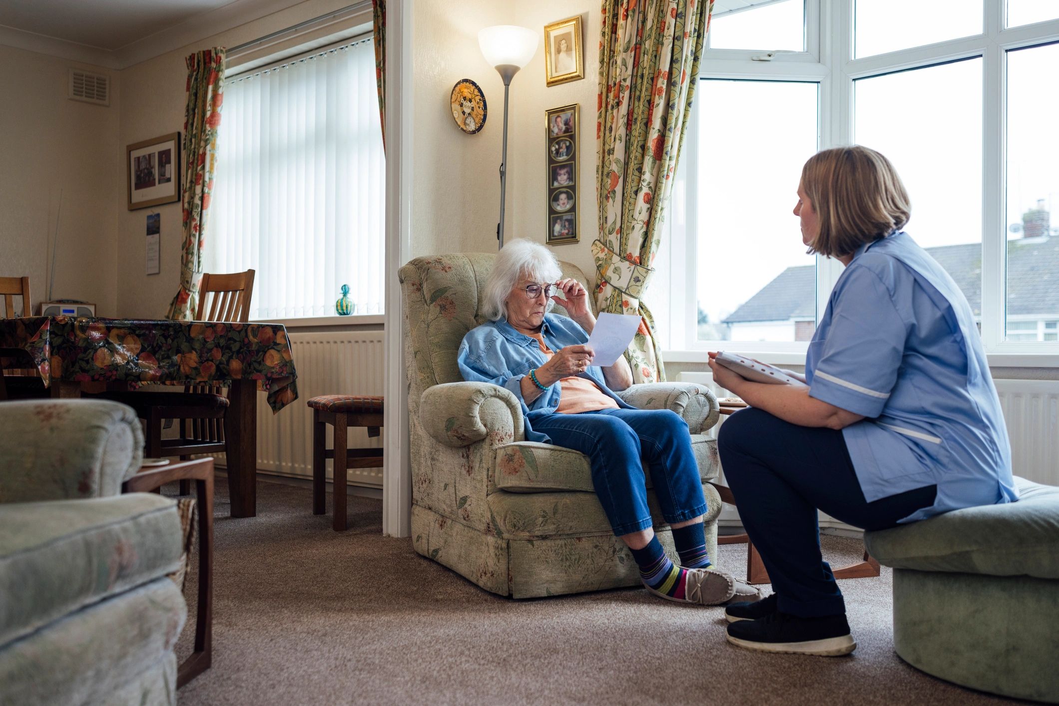 Caregiver speaking with a senior at home