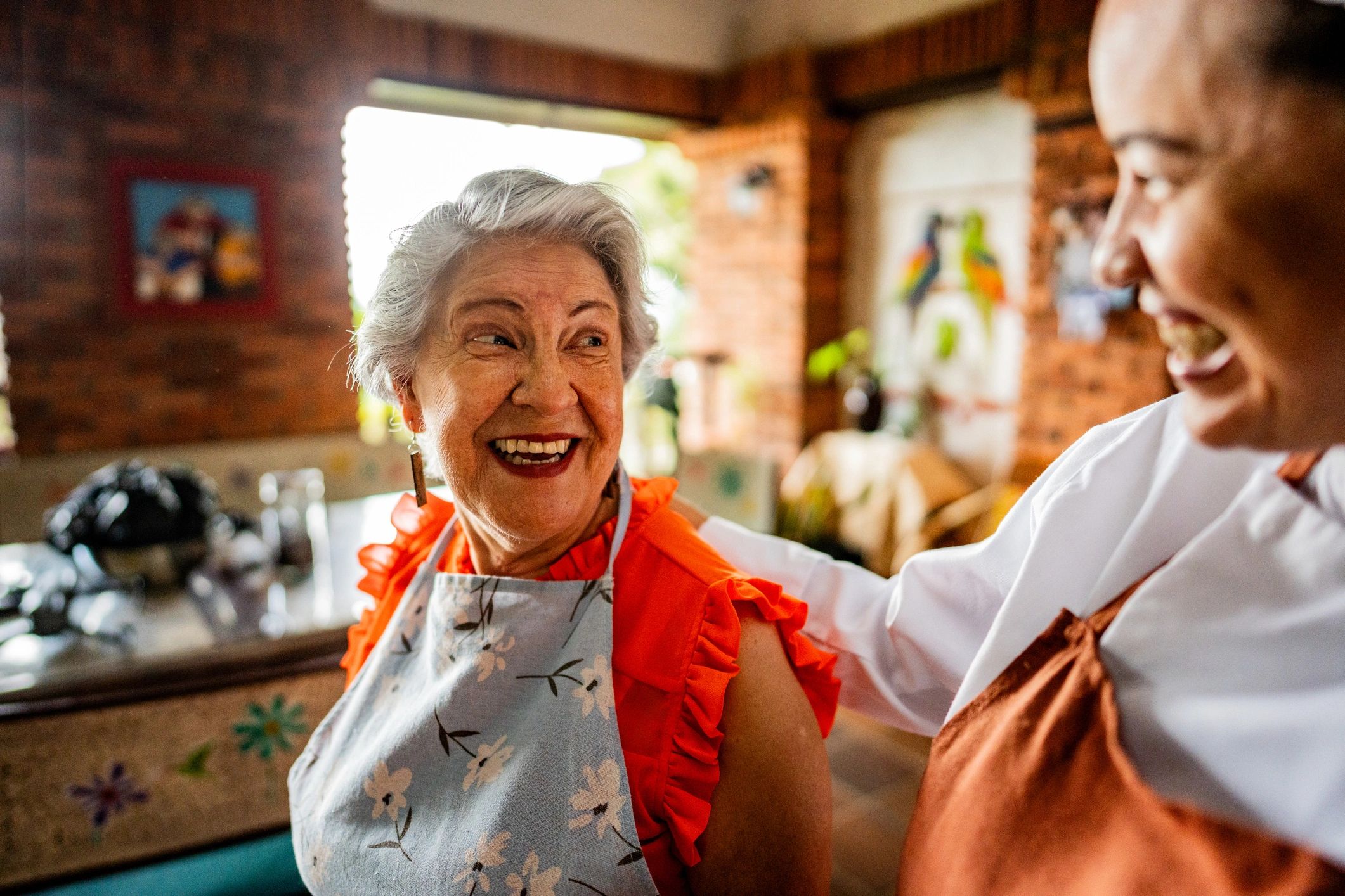 Senior woman cooking with support at home